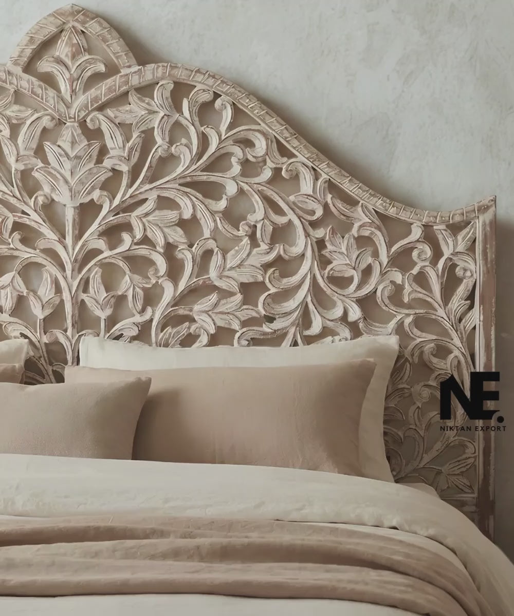 Whitewashed carved wood headboard