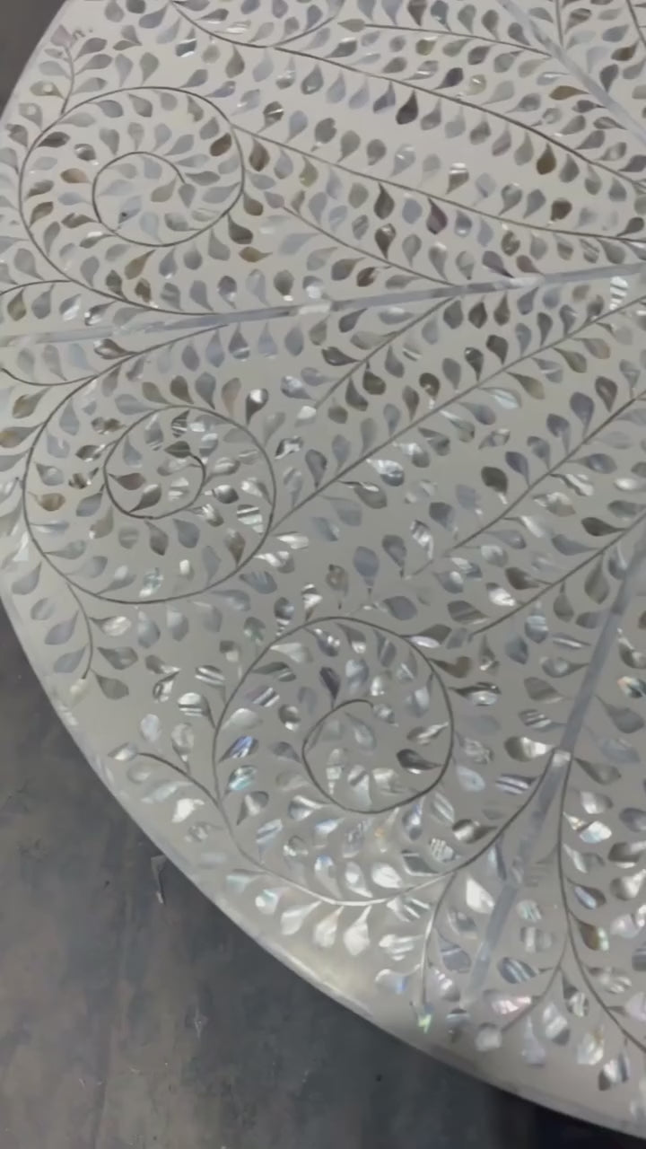 Round tabletop with mother of pearl and resin detail