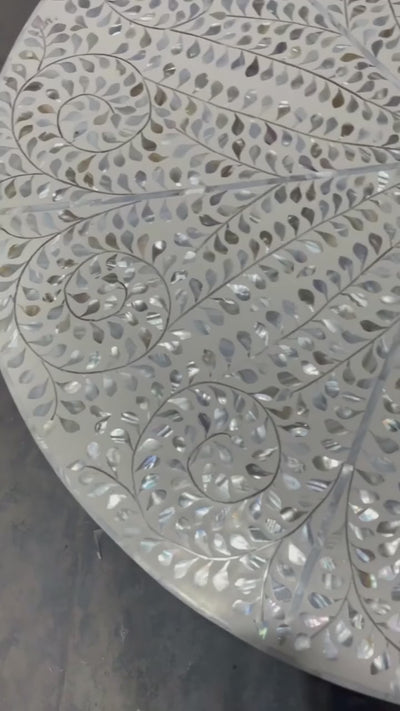 Round tabletop with mother of pearl and resin detail