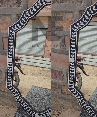 Leafy inlay pattern on decorative framed mirror
